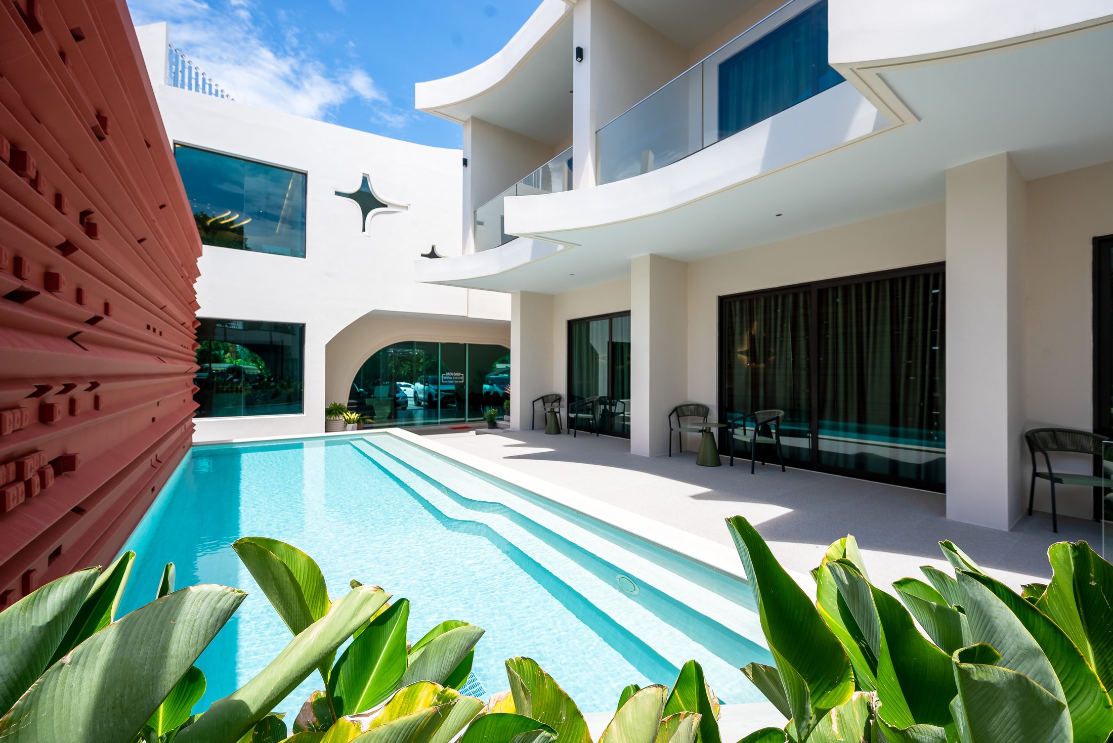 Pool and crimson louvred wall